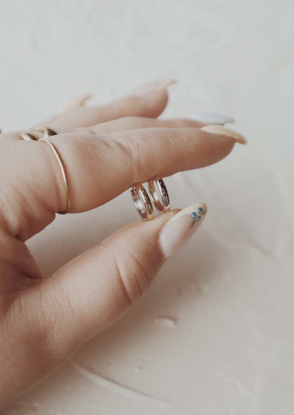 10k gold and white gold half and half huggies