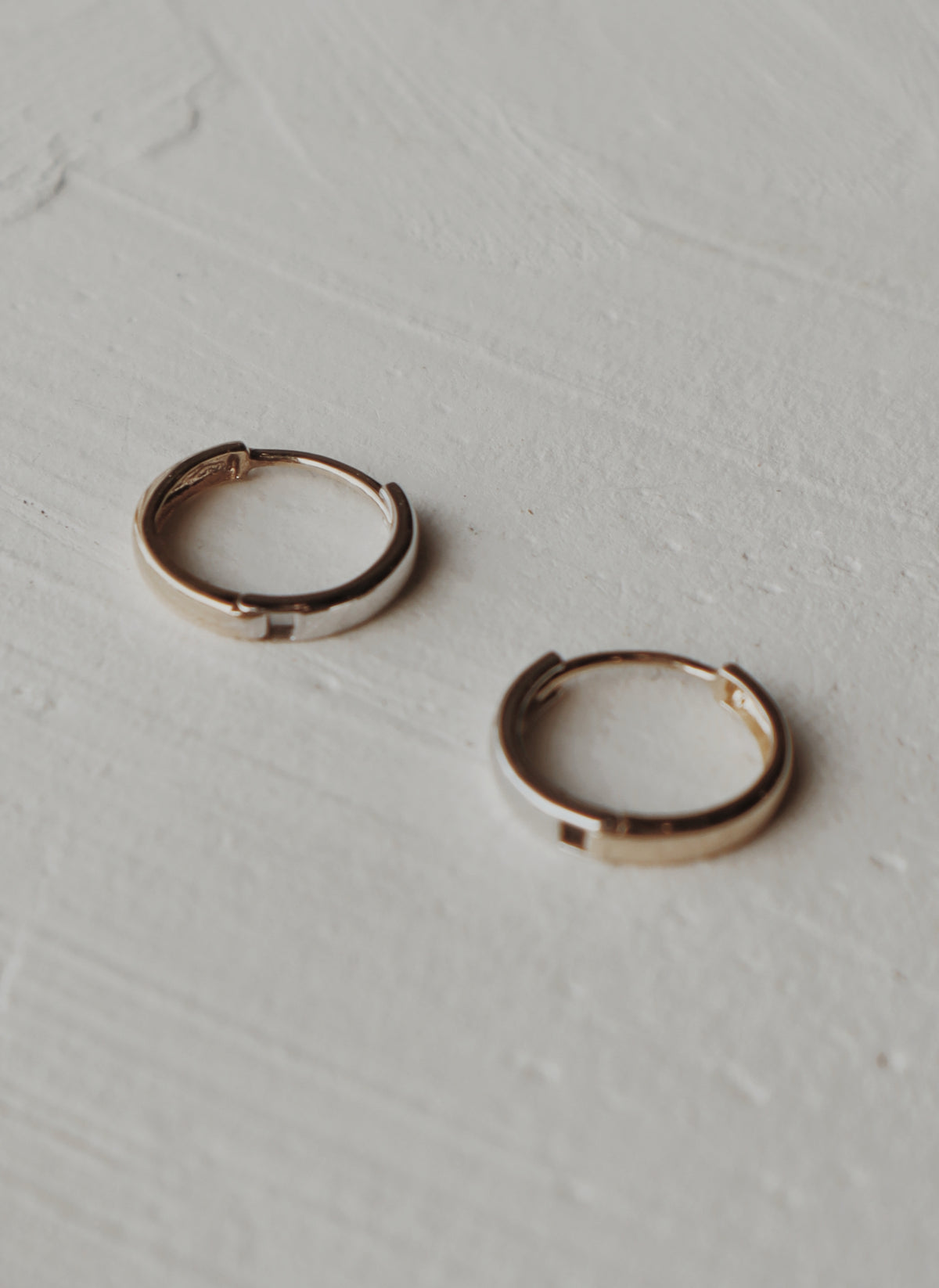 10k gold and white gold half and half huggies