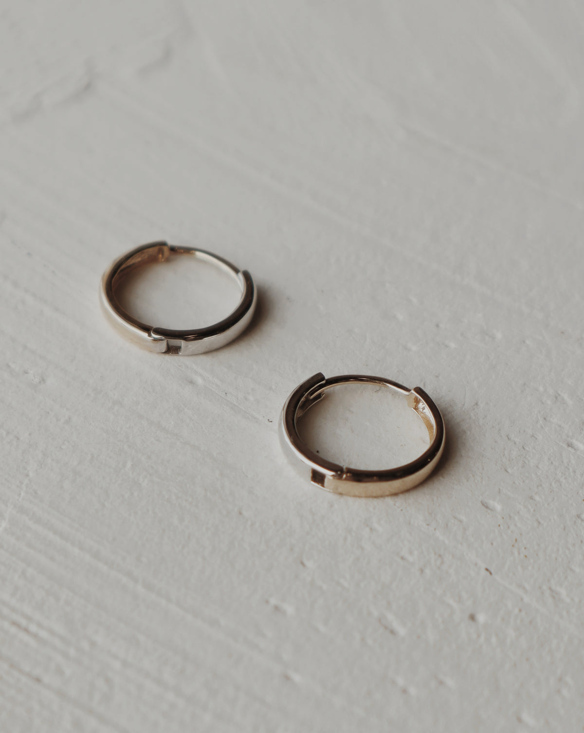 10k gold and white gold half and half huggies