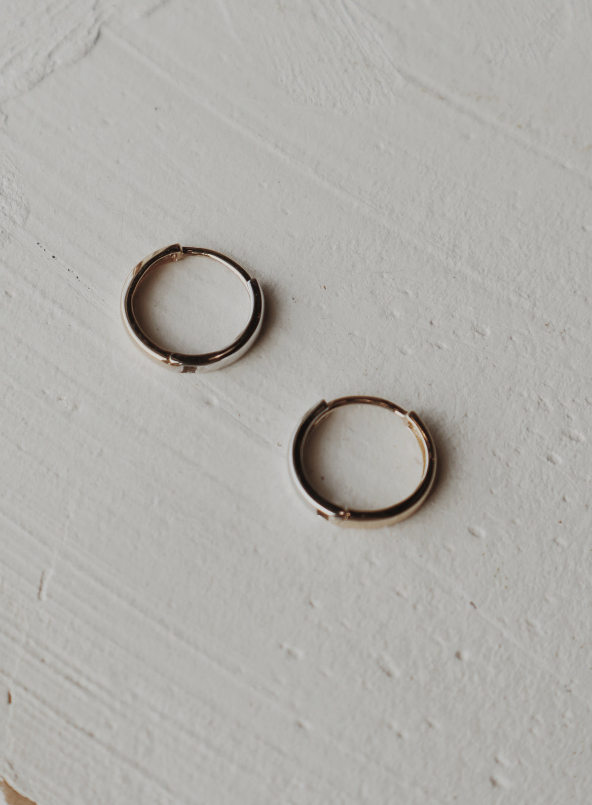 10k gold and white gold half and half huggies