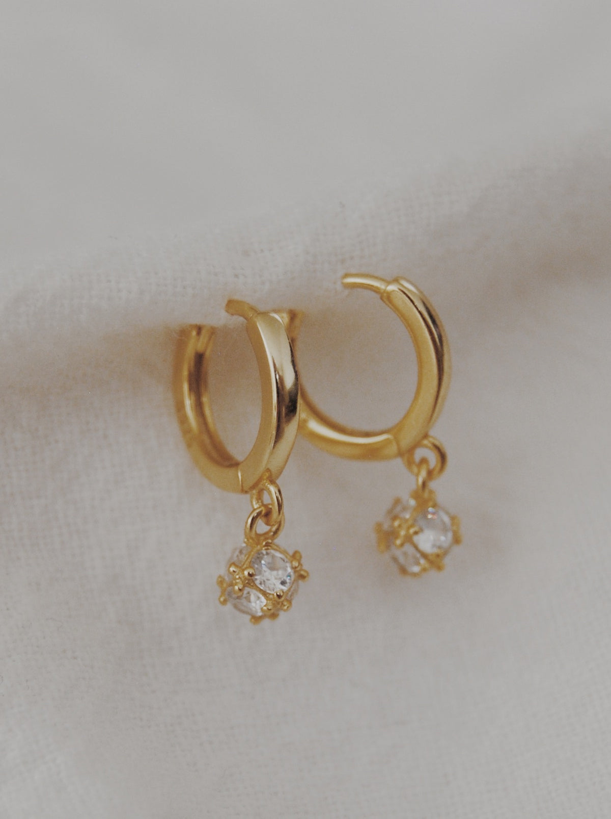 Dropping the Ball Huggie Hoop Earrings