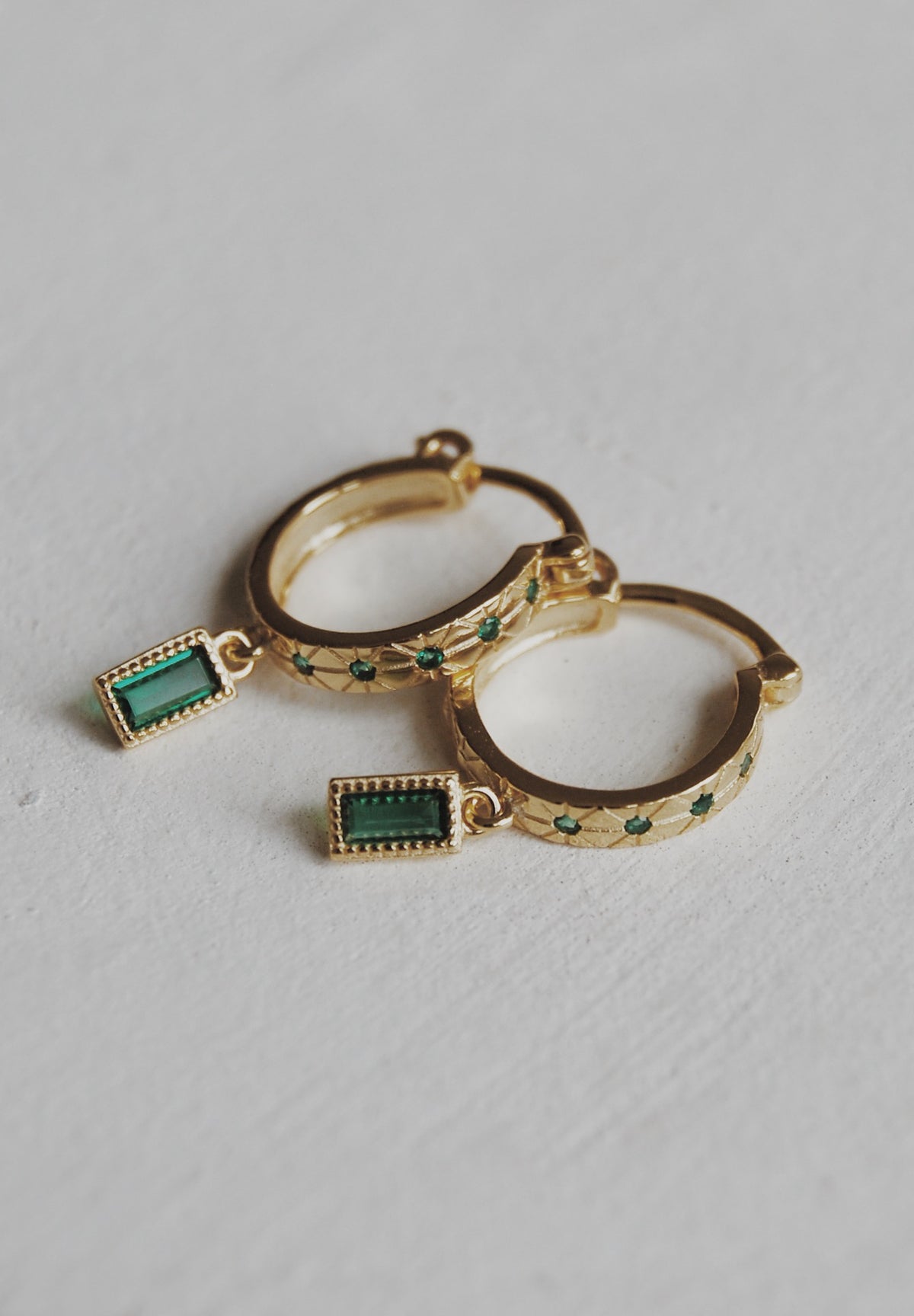 Rising Emerald Huggie Hoop Earrings