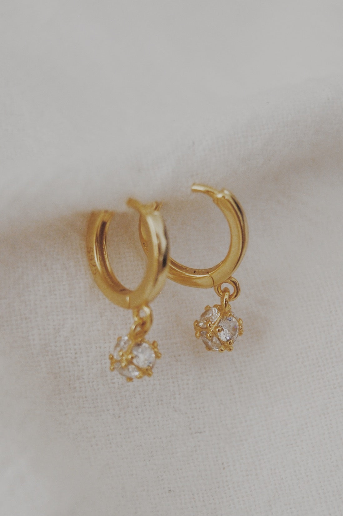 Dropping the Ball Huggie Hoop Earrings