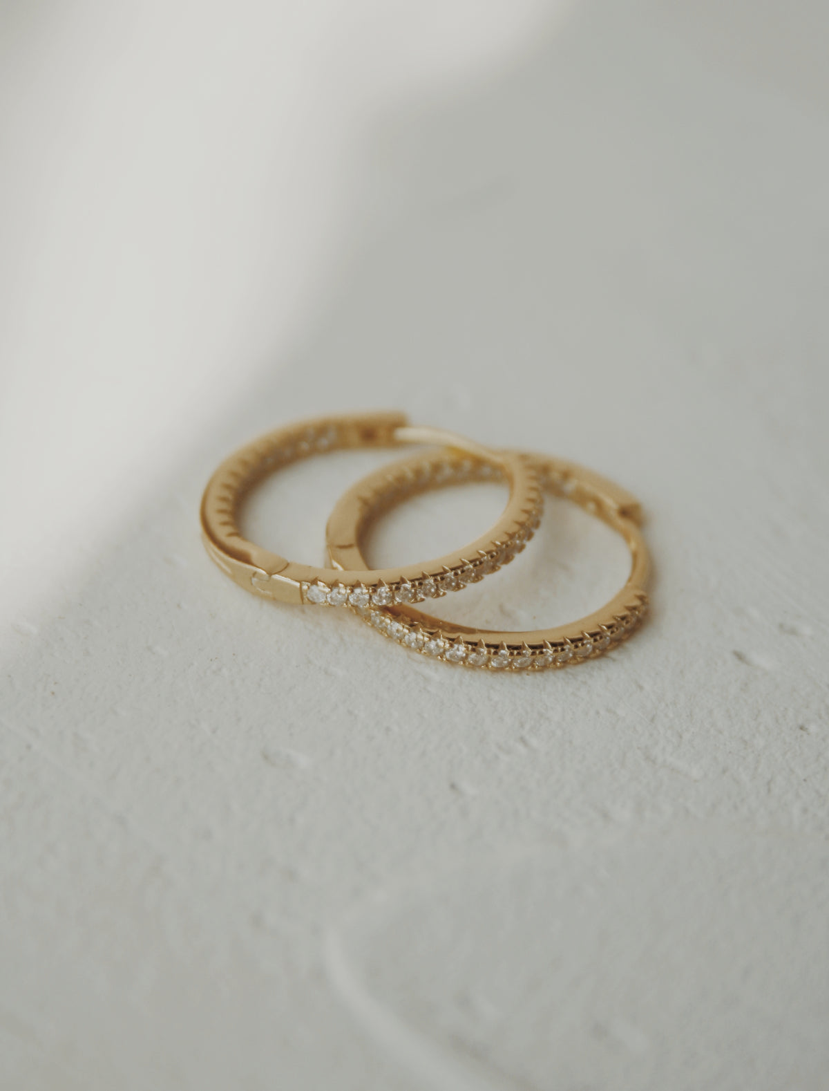 Nyla Huggie Hoop Earrings in Clear