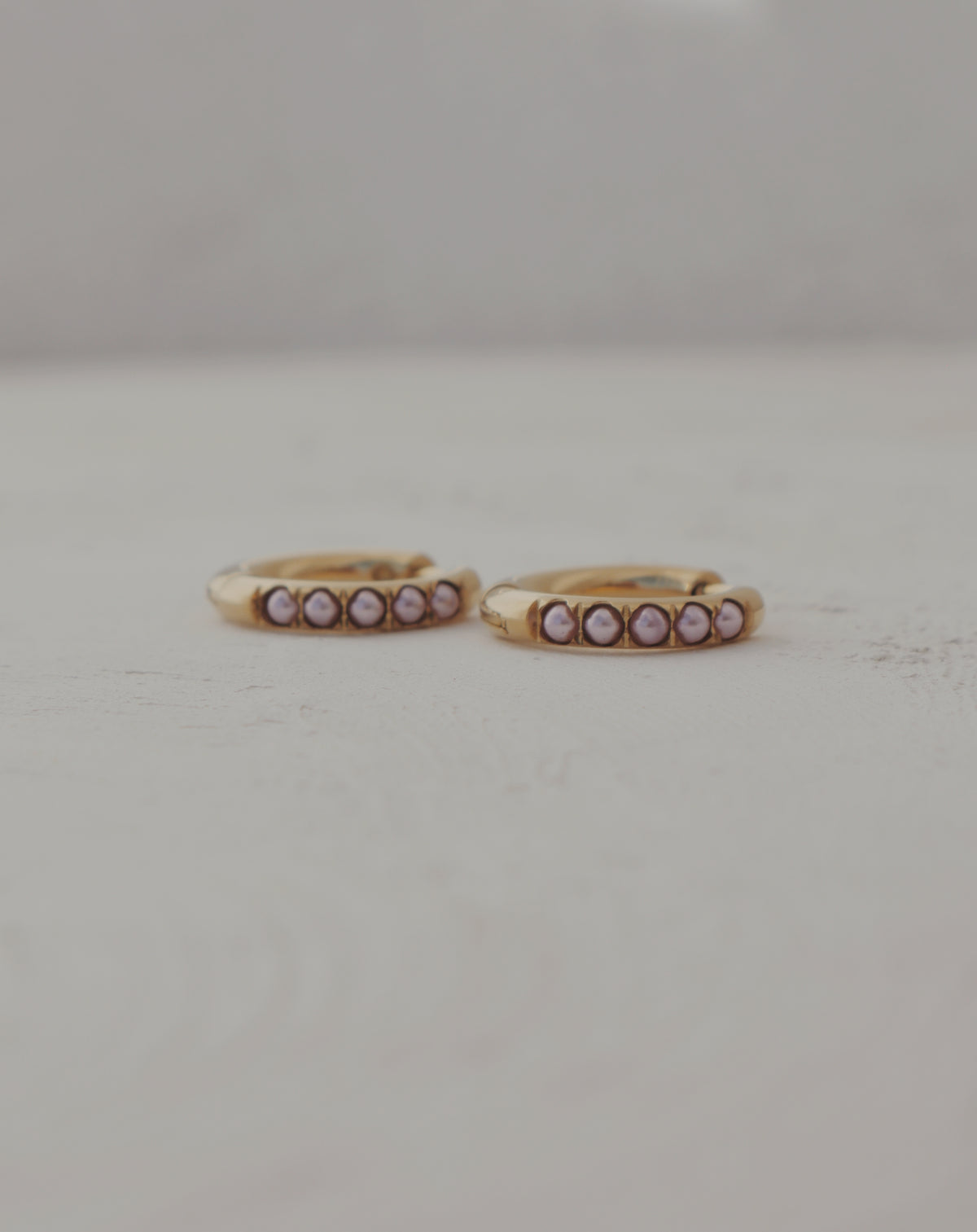 Glow Huggie Hoop Earrings in Soft Pink