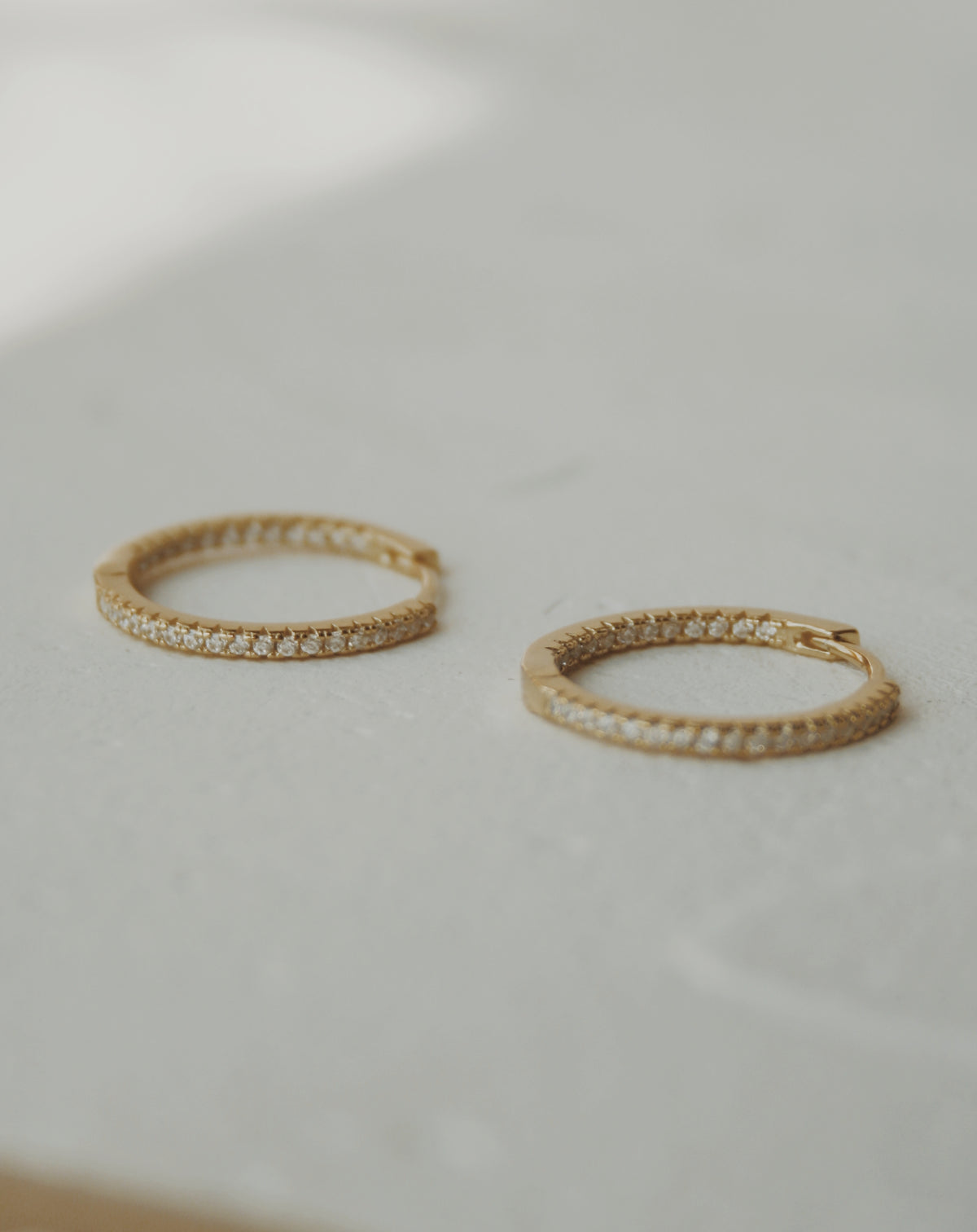 Nyla Huggie Hoop Earrings in Clear