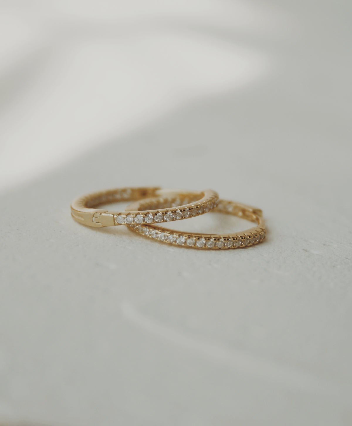 Nyla Huggie Hoop Earrings in Clear