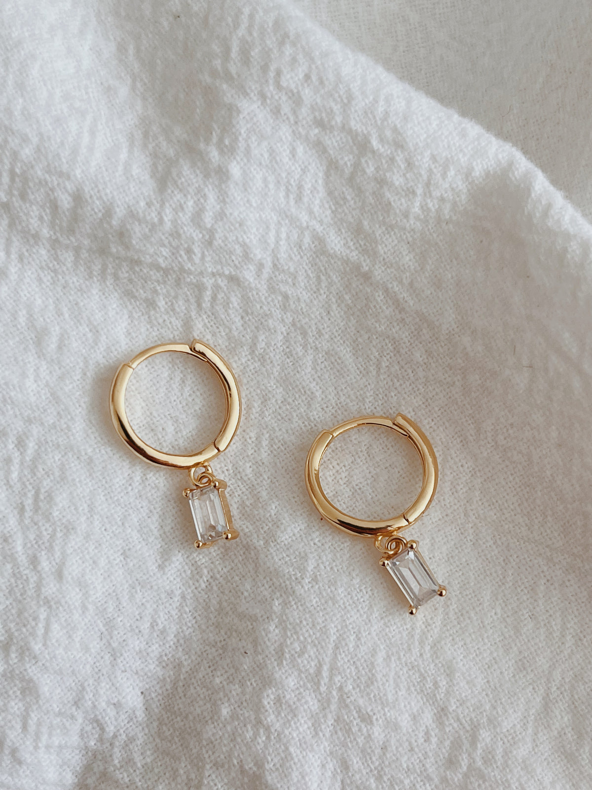 Azuriah Clear Huggie Hoop Earrings